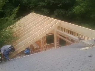 Framing a new roof addition that ties into an existing shingle roof in Somers